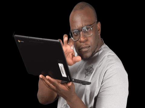 man typing quickly on laptop keyboard