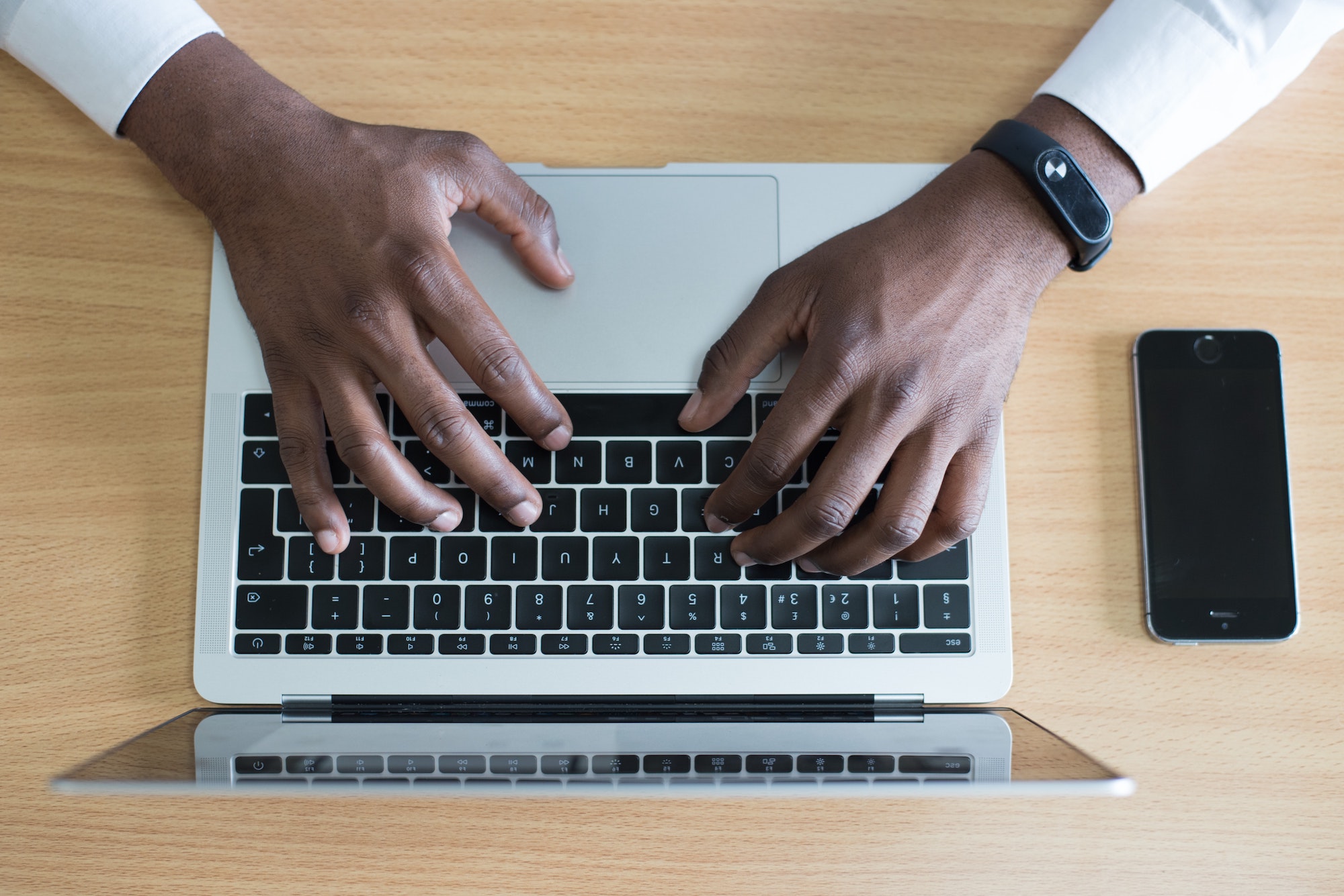 above view of someone typing on a laptop